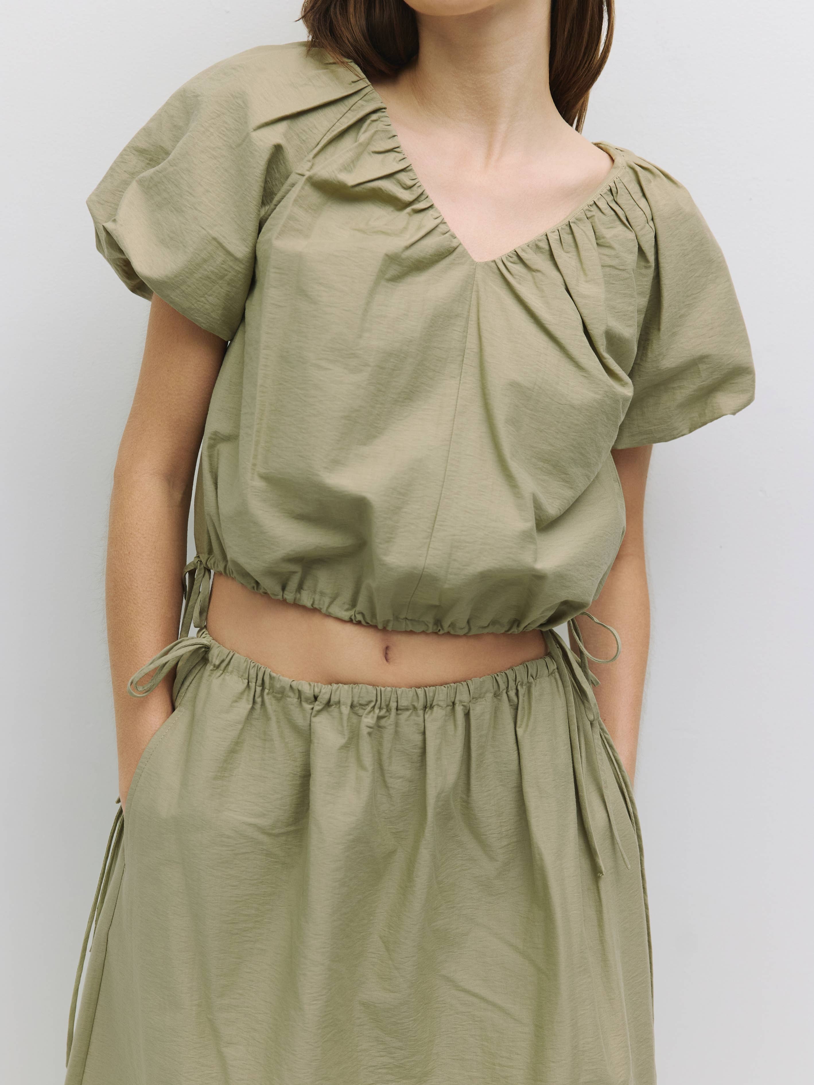 The Ina Bubble Hem Top with Side Ties in Olive or White